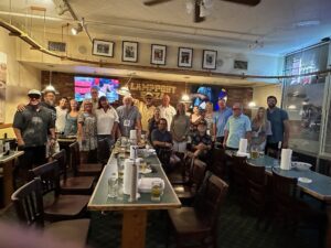 Group standing around tables
